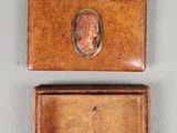two small wooden boxes with a picture of a woman on them