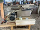 a workbench with tools on top of it in a workshop