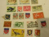 a lot of stamps that are on the table