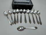 a lot of spoons and spoon spoons sitting on a table