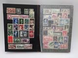an open book with a lot of stamps on the pages