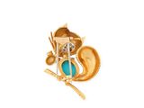 yellow gold plated brooch with a turquoise stone in the middle of it