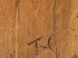 a small bird that is sitting on a piece of wood