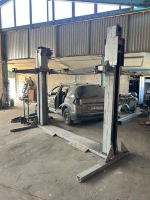 an image of a car being worked on in a garage