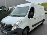 a picture of a white van parked in front of a building