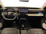 the interior of a car with a dashboard and a steering wheel
