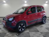 a picture of a small red car parked on a checkered floor