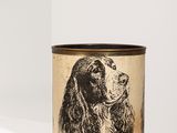 a close up of a dog ' s head on a cup on a shelf