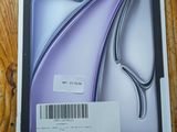 a picture of a box with a picture of a purple flower on it
