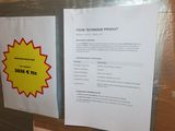 a piece of paper taped to a door with a price tag attached to it