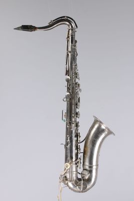 a close up of a saxophone on a white background