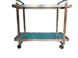 un chariot de service à roulettes en acier inoxydable et en verre bleu