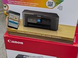 two boxes of printer and phone sitting on top of each other