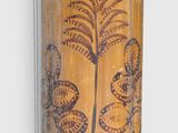a vase that has a picture of a palm tree on it