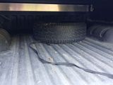 a truck that has a tire in the back of it
