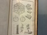 an open book with drawings of various objects on it