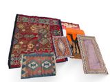many different types of rugs laid out on a white surface