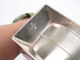 a person that is holding a metal object in their hand