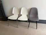 three chairs sitting next to each other in a room