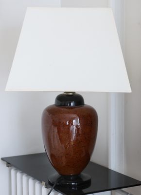 a lamp that is sitting on a table with a lamp on it
