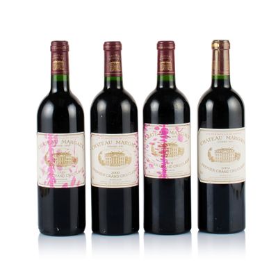 three bottles of wine are lined up in a row on a white surface