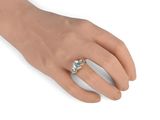 an image of a woman ' s hand with a ring on it ' s finger