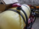 a large yellow tank with a hose attached to it