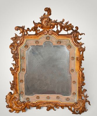an ornately carved mirror on a white wall with a white background