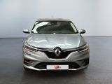 the front view of a silver car parked in a showroom