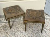 two small stools sitting next to each other on a tiled floor