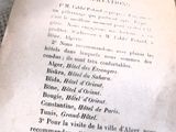 un vieux livre sur lequel figure une liste de choses
