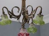 a picture of a chandelier with flowers hanging from the ceiling