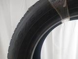 a tire that is sitting on a white surface