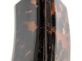 a small tortoise shell case with a zipper on it