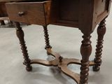 a small table with a drawer on top of it