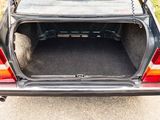 the back of a car with its trunk open on the road