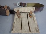 a bag with a belt and a belt on a table