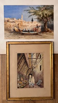 tableau représentant un homme assis dans une pièce, à côté d'un tableau représentant un village