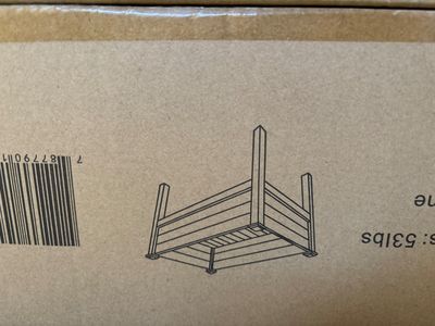 a cardboard box with a drawing of a chair on it
