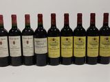 six bottles of wine are lined up in a row on a white surface