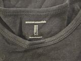 a close up of a t shirt with the amazon essentials logo on it