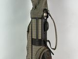an image of a golf bag with a brown and white checkered cover