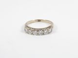 a white gold ring set with three round brilliant cut diamonds