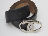 a close up of a black belt with a silver buckle