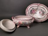 two dishes and a bowl sitting on a table