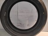 a close up of a tire tire on a white surface