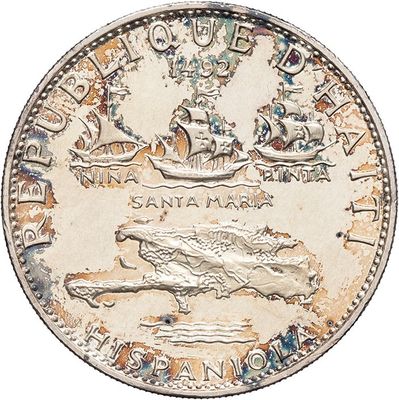 an old silver coin with a picture of a ship in the middle of it