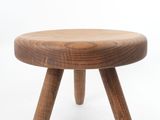 an image of a wooden stool with three legs on a white background