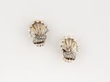 a pair of gold and diamond ear clips