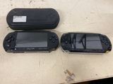 three nintendo wii controllers sitting on a table next to each other